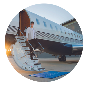 Man arriving on private jet Air Partner